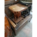 A carved oak monk's bench/table.