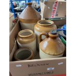 A box containing five stoneware jars/flagons.