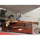 5 vintage walking sticks, one with silver collar and a vintage case.