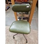 A vintage adjustable swivel chair