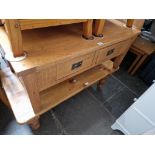 An oak coffee table and a pine coffee table.