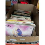 A box of vinyl 7" singles records.