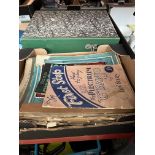 Three boxes of vintage sheet music and song books.