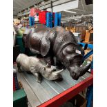 A large leather clad model Rhino, length 80cm, and another.