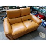 A modern leather reclining 2 seater sofa