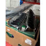A box of car parts including brake pads and disks, BMW kidney grills, VW Crafter wind deflectors