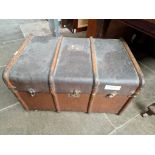 A vintage beech bound steamer trunk.