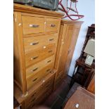 A suite of modern light oak bedroom furniture comprising wardrobe, chest of drawers and tallboy