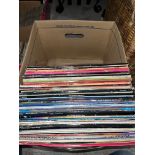 A box of approx 64 LPs and 12" singles, mixed genre.