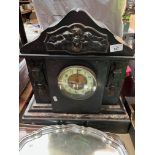A large Victorian slate mantel clock with enamelled face, no pendulum and no key.