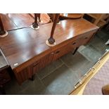 A mid 20th century teak sideboard.