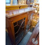 An Edwardian inlaid mahogany astral glazed bookcase.