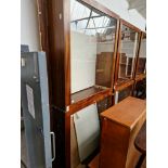 A pair of large glazed mahogany display cabinets with interior lights.