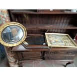 A Regency style convex mirror (19th century frame with later mirrored glass) together with an oak