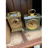 A brass carriage clock by Fattorini of Bradford and an onyx carriage clock by Baronet
