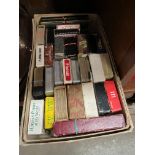 A box containing a collection of vintage playing cards.