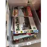 A box of railway magazines and books.