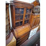 An early 20th century oak bureau bookcase.