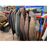 A clothes rail containing ladies and gents coats, jackets, including sheepskin, wool, suede,