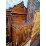 A Victorian walnut chiffonier.