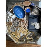 A tin of assorted items including pocket watch movements, a Links of London watch, a £5 coin etc.