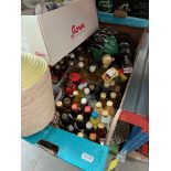 A box of alcoholic miniatures and few bottles of alcoholic beverages together with a small