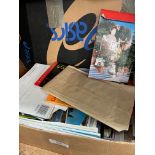 A box containing unused post cards from around the world and video photo discs