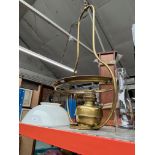 A brass ceiling oil lamp with milk glass shade and funnel, height approx. 95cm.