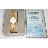 A ladies 9ct gold Longines bracelet watch, case diam. 21mm, length 14cm/15cm, gross wt. 23.1g,