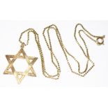 A 9ct gold star of David pendant, sponsor 'FM', London 1970, on 56cm chain marked '375', wt. 11.8g.