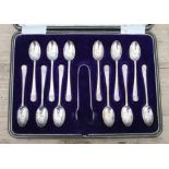 A cased set of 12 silver teaspoons with sugar tongs, C W Fletcher & Son Ltd, Sheffield 1916.