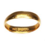 A 22ct gold wedding band, sponsor 'SH', Birmingham 1923, wt. 4.1g, size P. condition - worn and