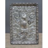 An Edwardian embossed silver tray, decoration depicting the Green Man, a bird amongst floral