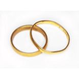 Two hallmarked 22ct gold wedding bands, wt. 5.1g, size K & Q.