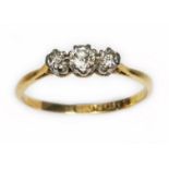 An antique three stone diamond ring, total approx. diamond wt. 0.16cts, band marked '18ct PLAT',