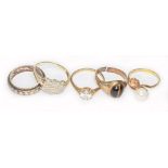 A group of five rings, hallmarked 9ct gold or marked '9ct' or similar, gross wt. 15.3g, as found.