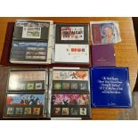 Two albums of assorted first day covers and presentation packs togehter with various commemorative