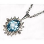 An aquamarine and diamond pendant, the oval mixed cut aquamarine weighing approx. 1.58cts,