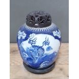 A Chinese blue and white porcelain ginger jar with carved hardwood cover and stand, unmarked, 18th/