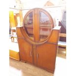 A 1930s Art Deco oak cabinet, height 162cm.