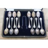 A cased set of twelve George V rat tail silver spoons with sugar tongs, John Sanderson, Sheffield