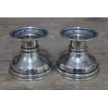 A pair of Egyptian silver candlesticks, height 6cm, wt. 4ozt.