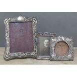 A group of three early 20th century hallmarked silver photograph frames, tallest 30cm.