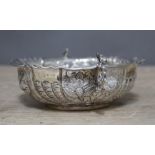 A Victorian embossed twin handled shallow silver dish, William Comyns, London 1886, length 15cm, wt.