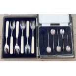 Two cased sets of silver cutlery comprising a part set of bean spoons and a set of forks (handles