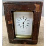 A French brass repeater carriage clock with leather case.