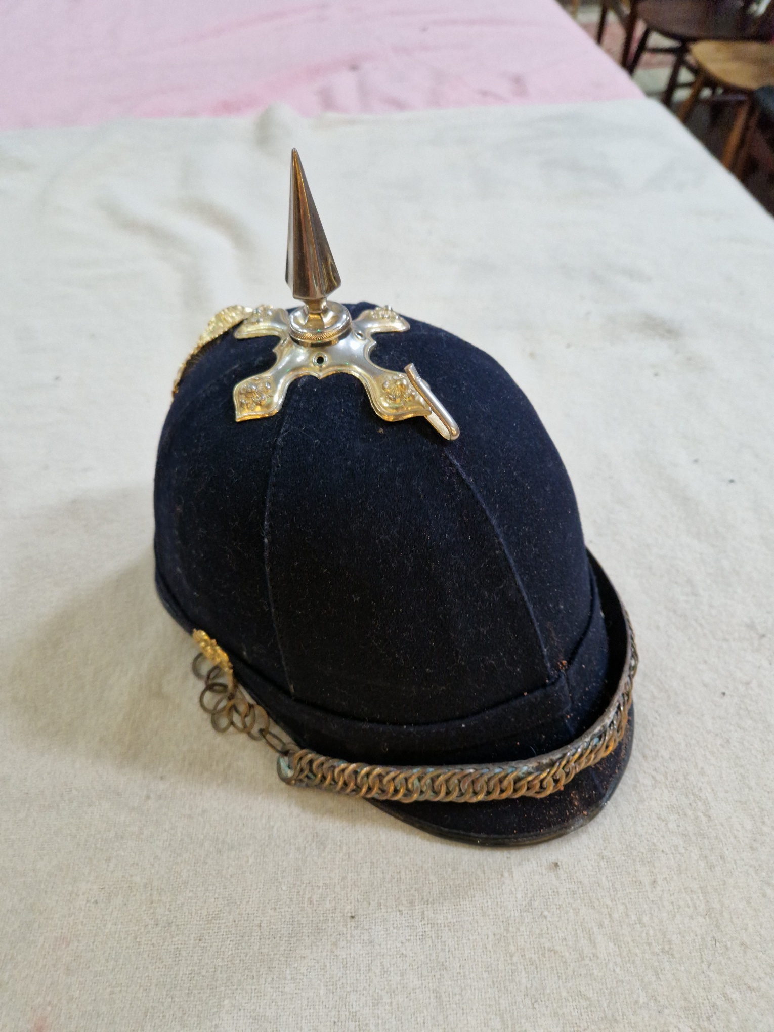 A group of four military helmets to include two Manchester Regiment Officer's blue cloth helmets, - Image 12 of 13