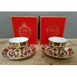 A set of two Royal Crown Derby 1128 Imari teacups and saucers, with boxes.