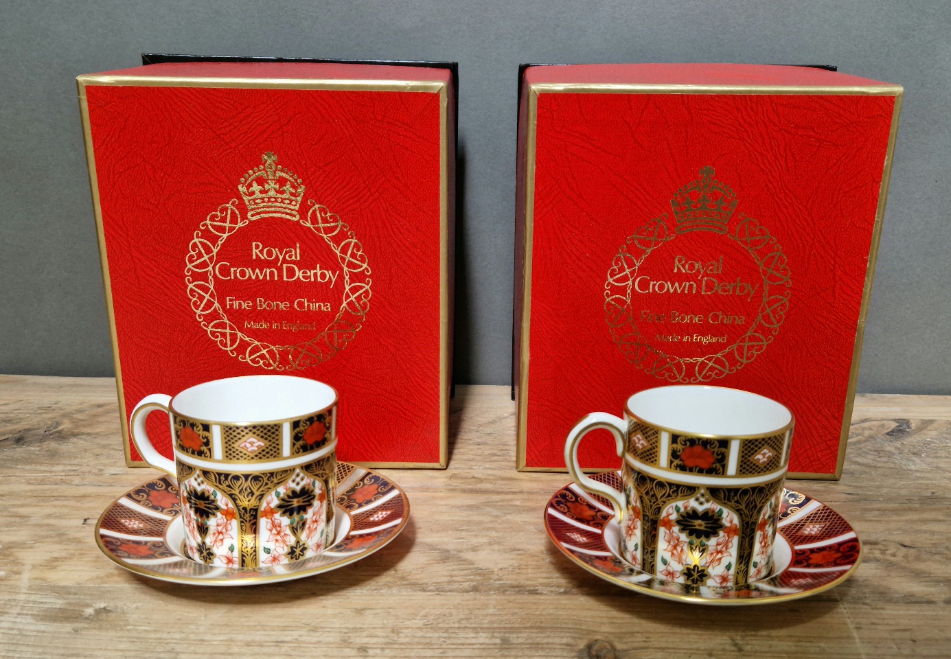 A set of two Royal Crown Derby 1128 Imari coffee cups and saucers, with boxes.