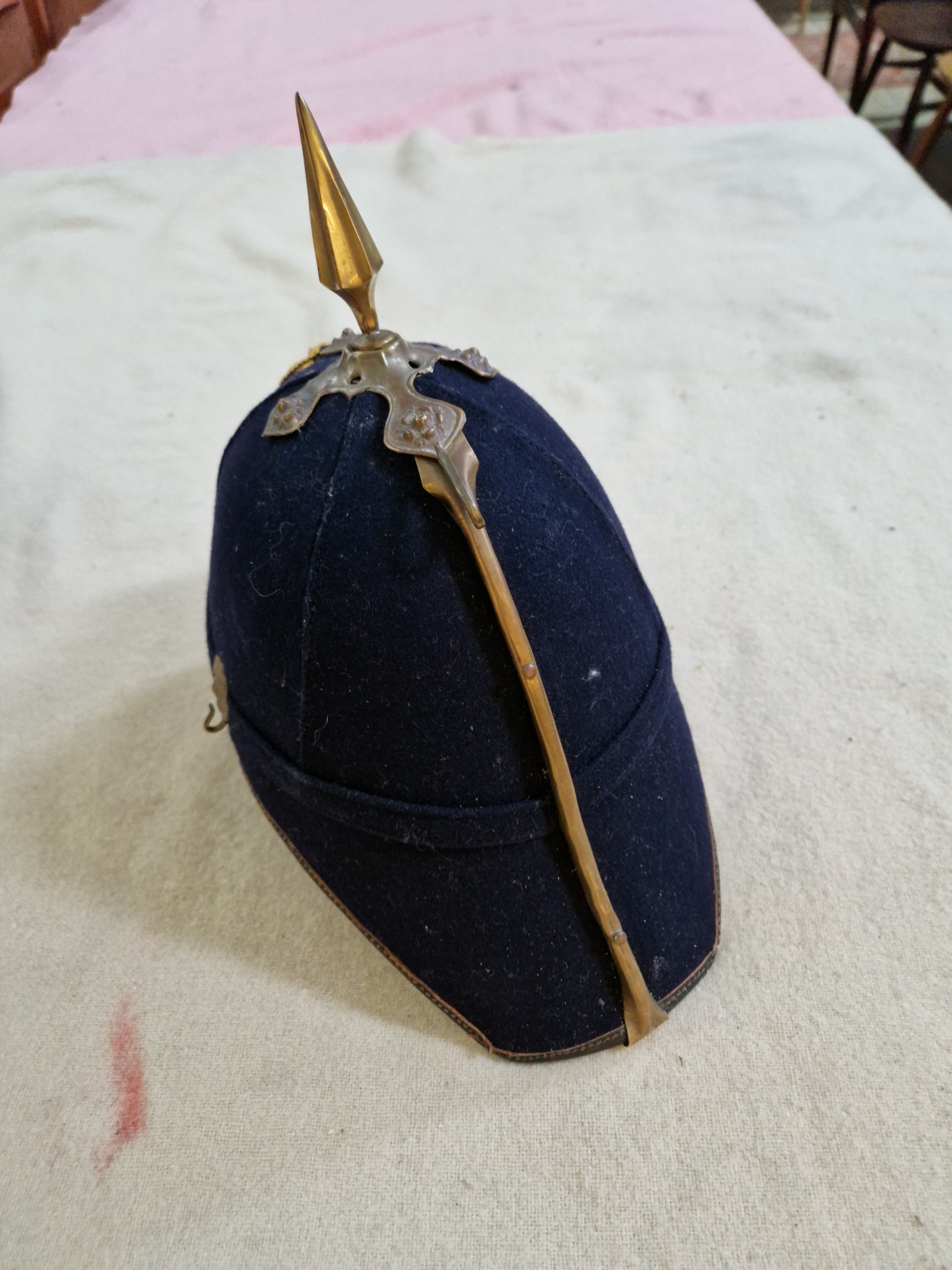 A group of four military helmets to include two Manchester Regiment Officer's blue cloth helmets, - Image 3 of 13